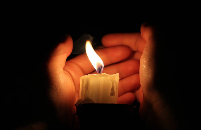 candle burning hand wind blows out 18093